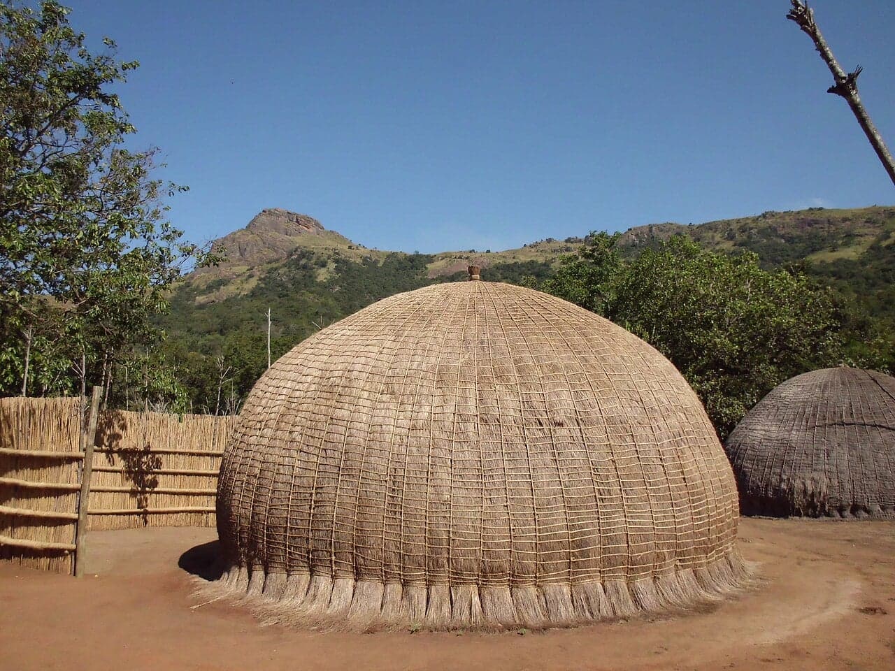 Beehive-shaped thatched huts in a circle at Mantenga Cultural Village
