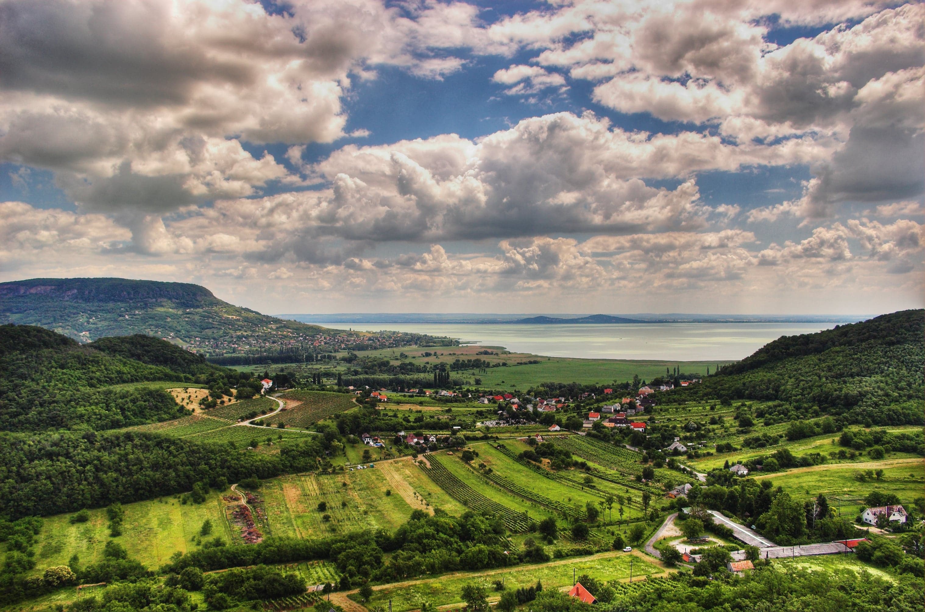Sailboats on the calm blue water of Lake Balaton with a sunny sky