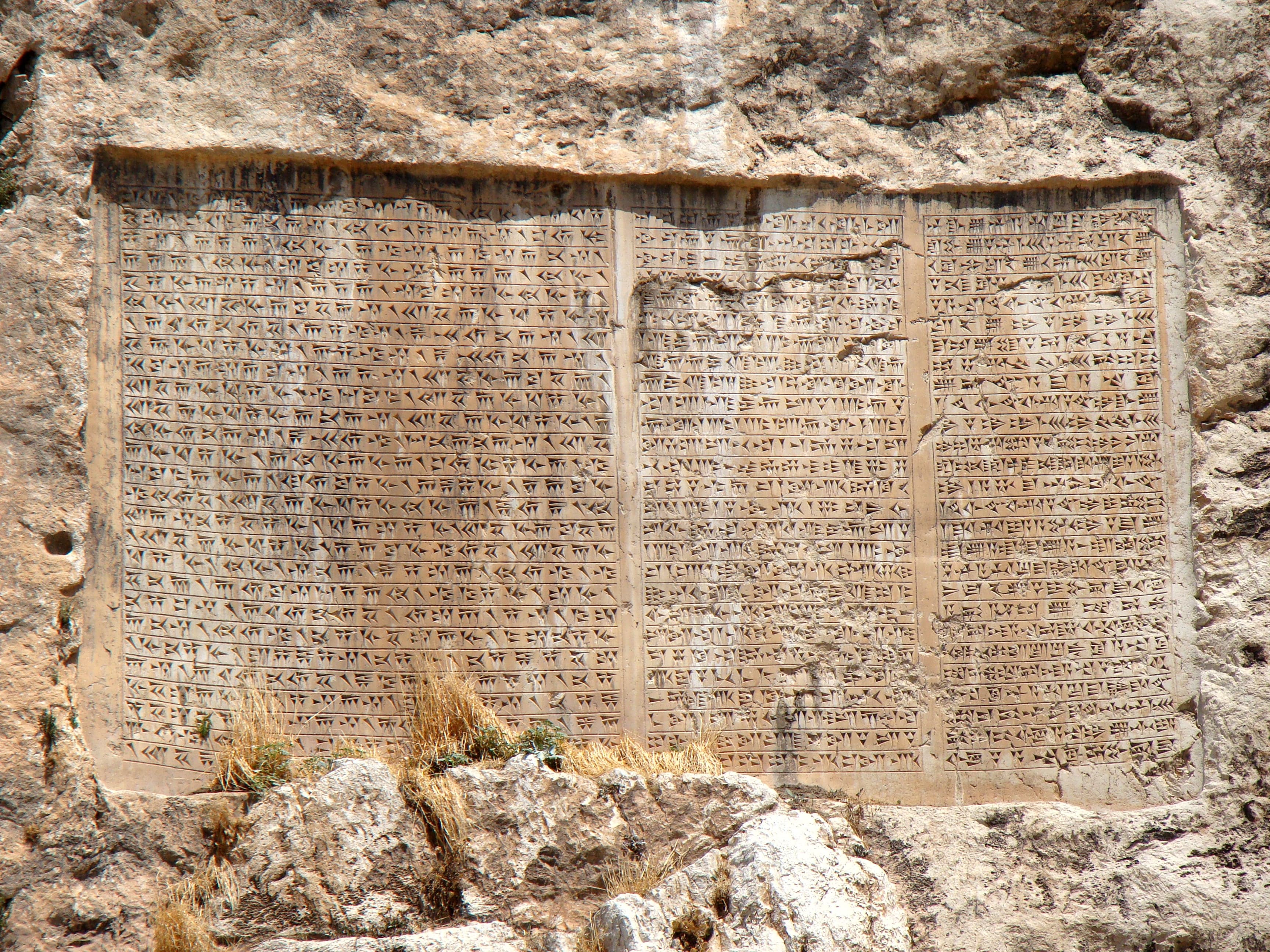 A clay tablet covered in wedge-shaped cuneiform marks