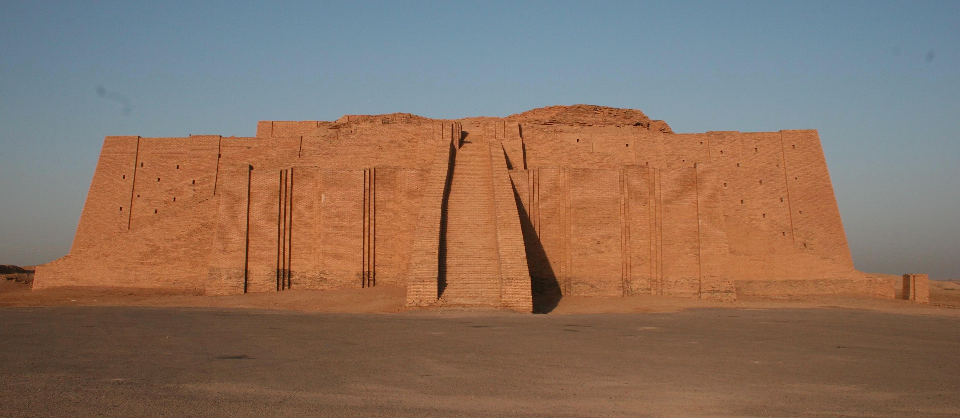 The Great Ziggurat of Ur, a huge stepped mud-brick pyramid rising from the Iraqi plain