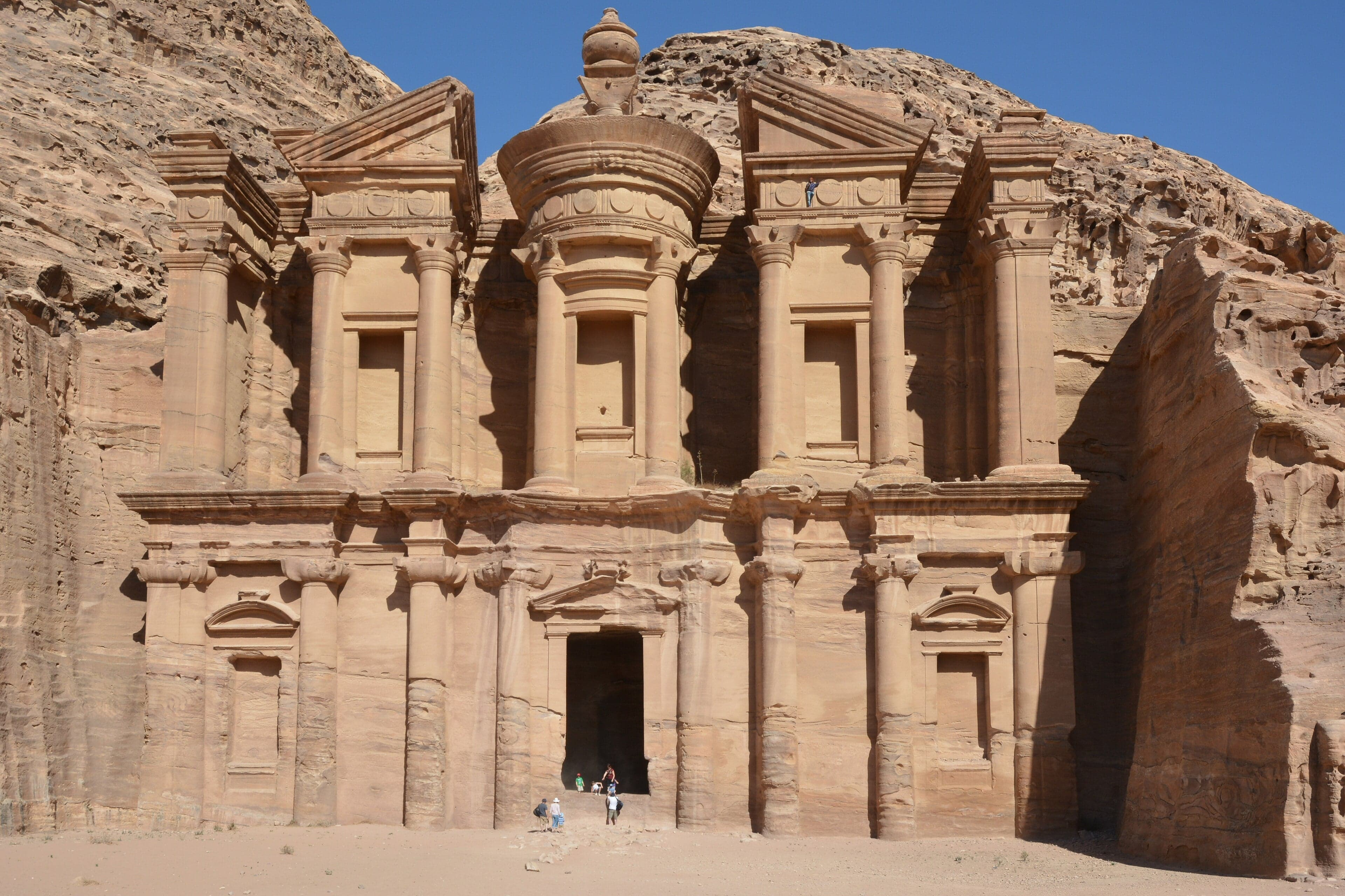 The famous Treasury building carved into the rose-red sandstone cliffs of Petra