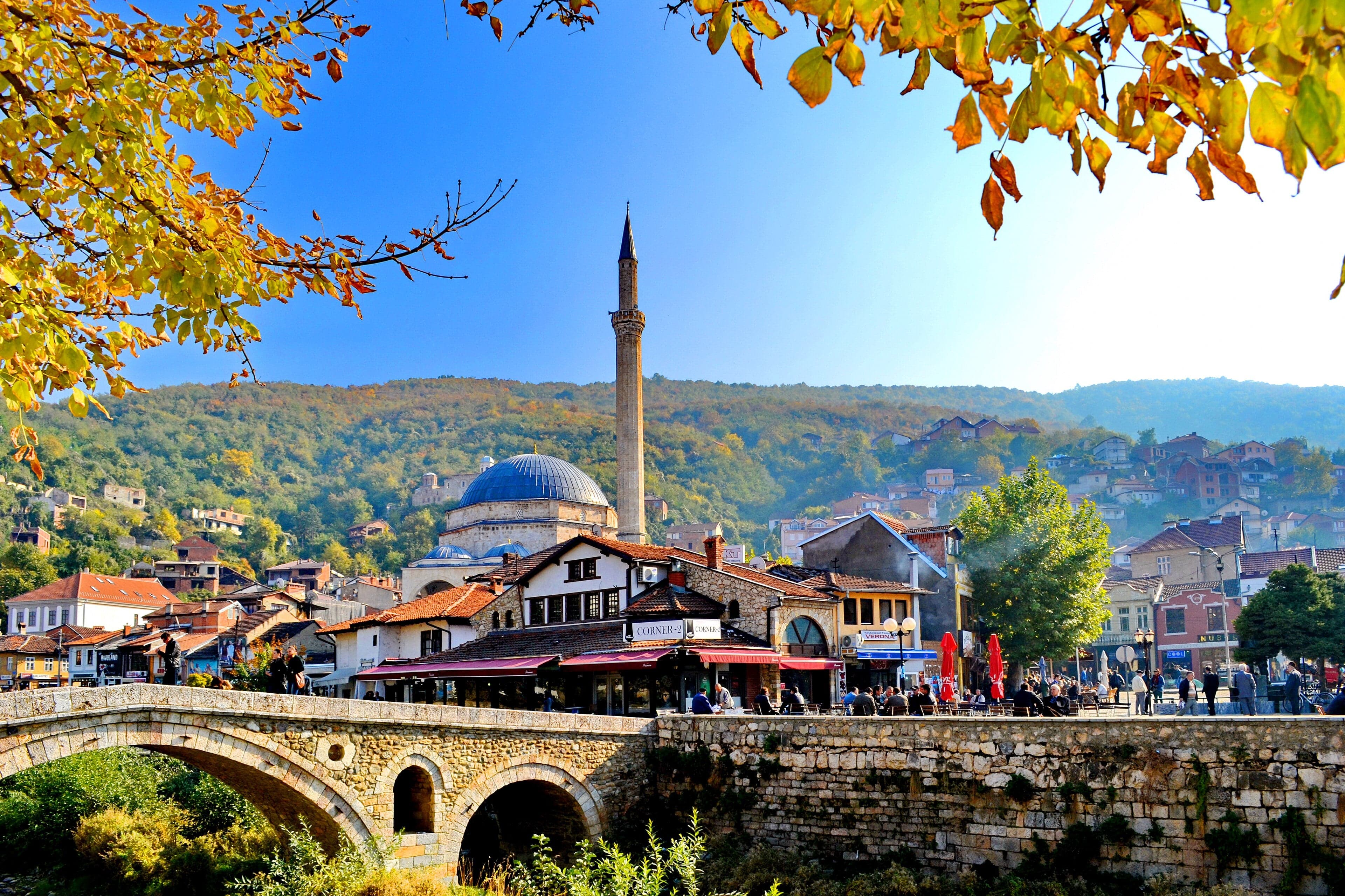 The stone bridge of Prizren with the old town and fortress behind it