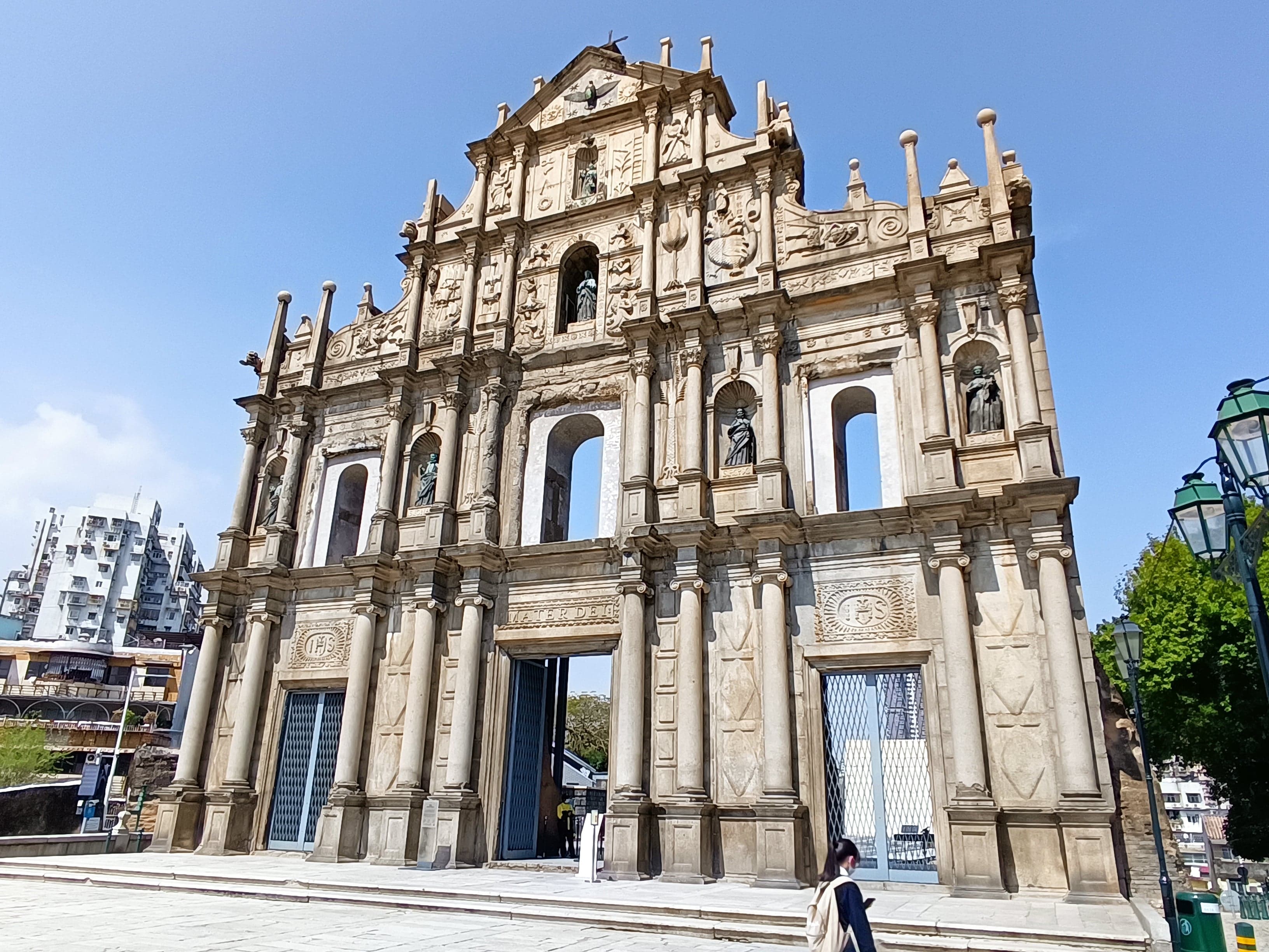 Colourful Portuguese-style buildings alongside Chinese temples in Macau's historic centre