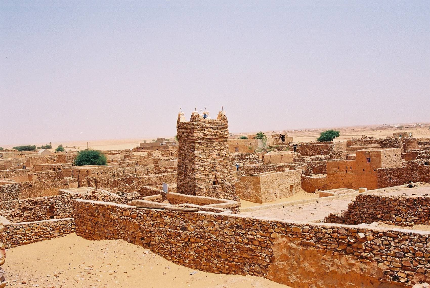 The ancient mud-brick minaret of Chinguetti rising above the desert town
