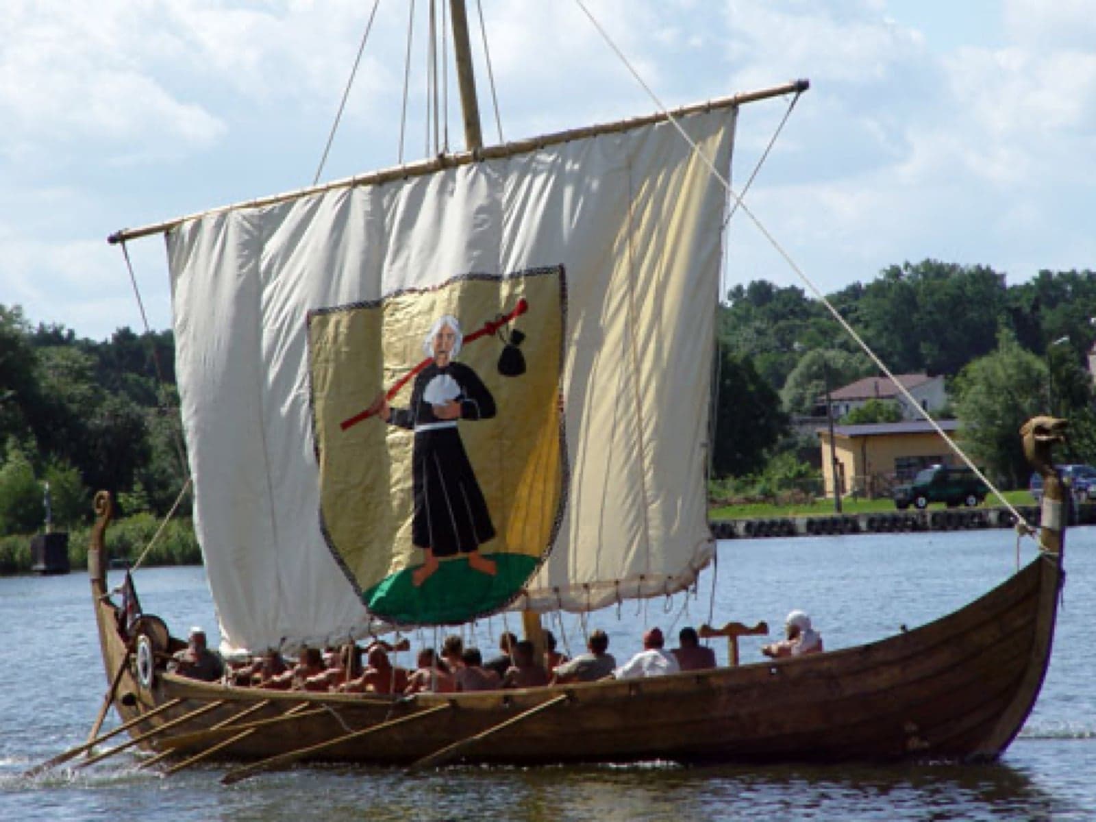A replica Viking longship sailing on a Norwegian fjord