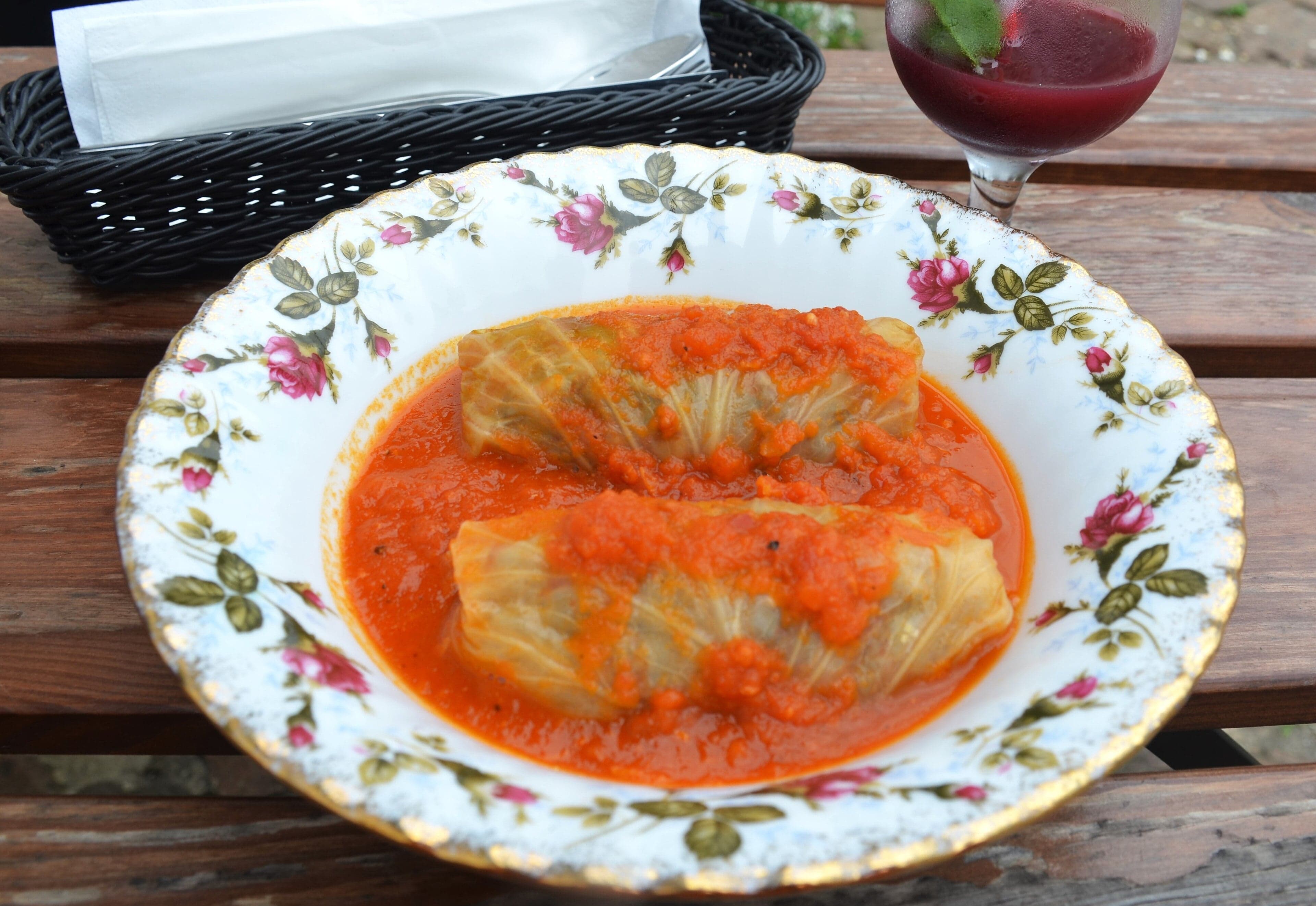 A plate of sarmale - Romanian cabbage rolls in tomato sauce