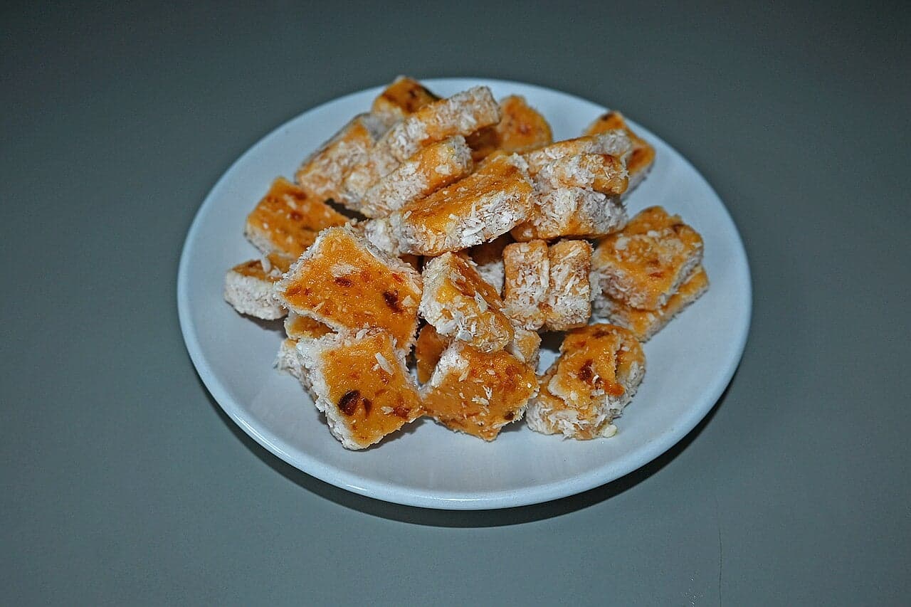 Pink and white sugar cakes made from coconut and sugar on a plate
