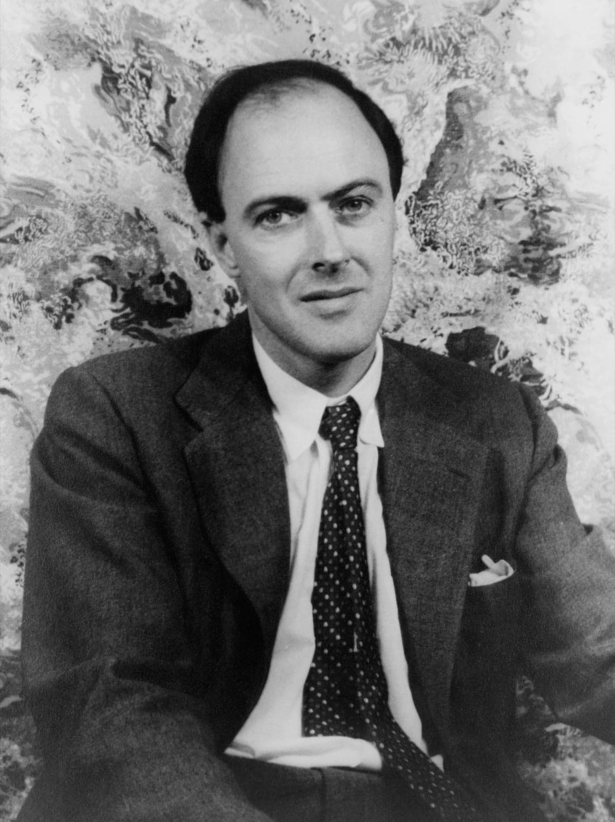 A black-and-white photograph of the author Roald Dahl