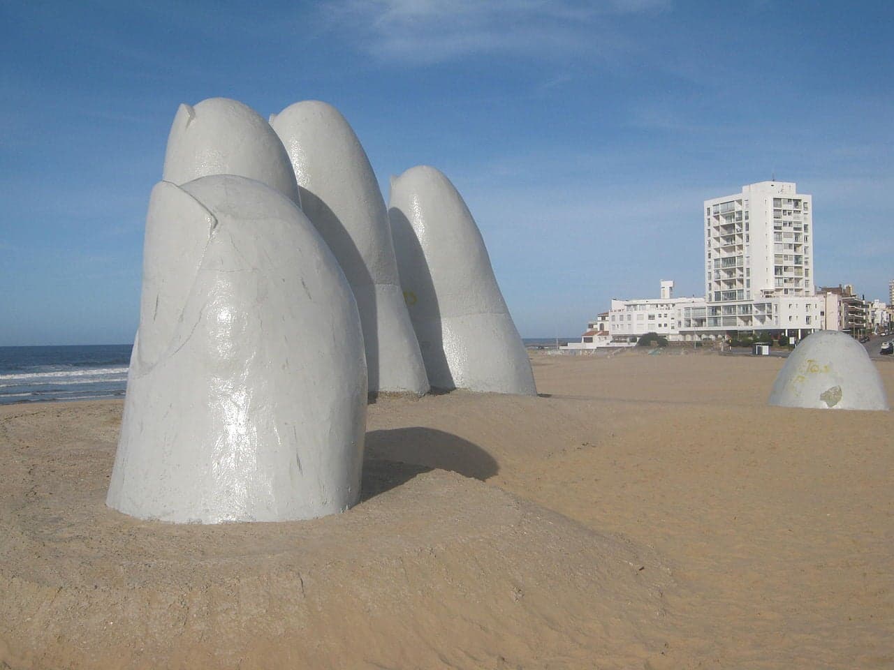 La Mano de Punta del Este - a giant sculpture of five fingers rising out of the sand on the beach
